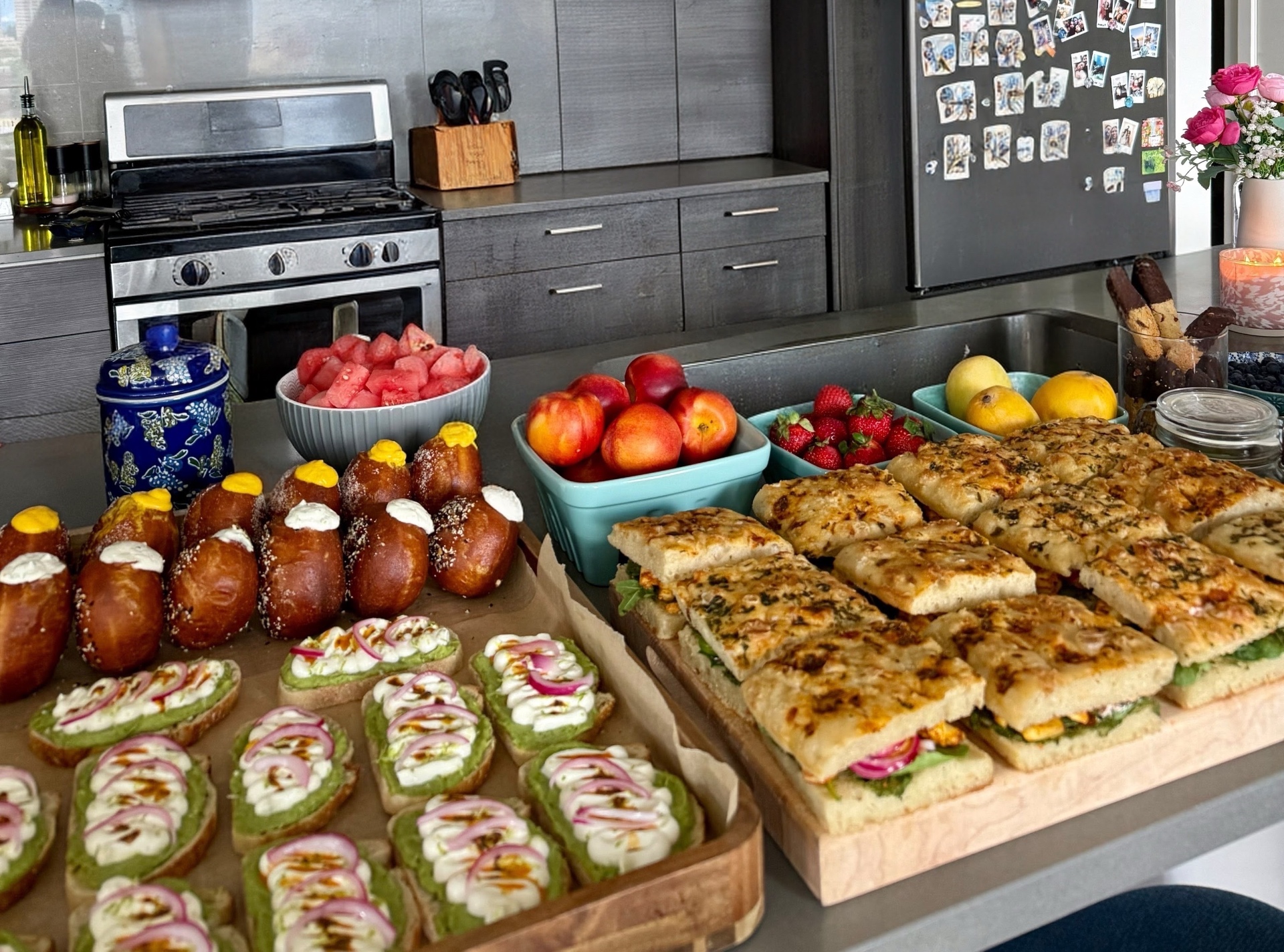 Brunch spread — stuffed brioche donuts, avocado toasts, focaccia sandwiches
